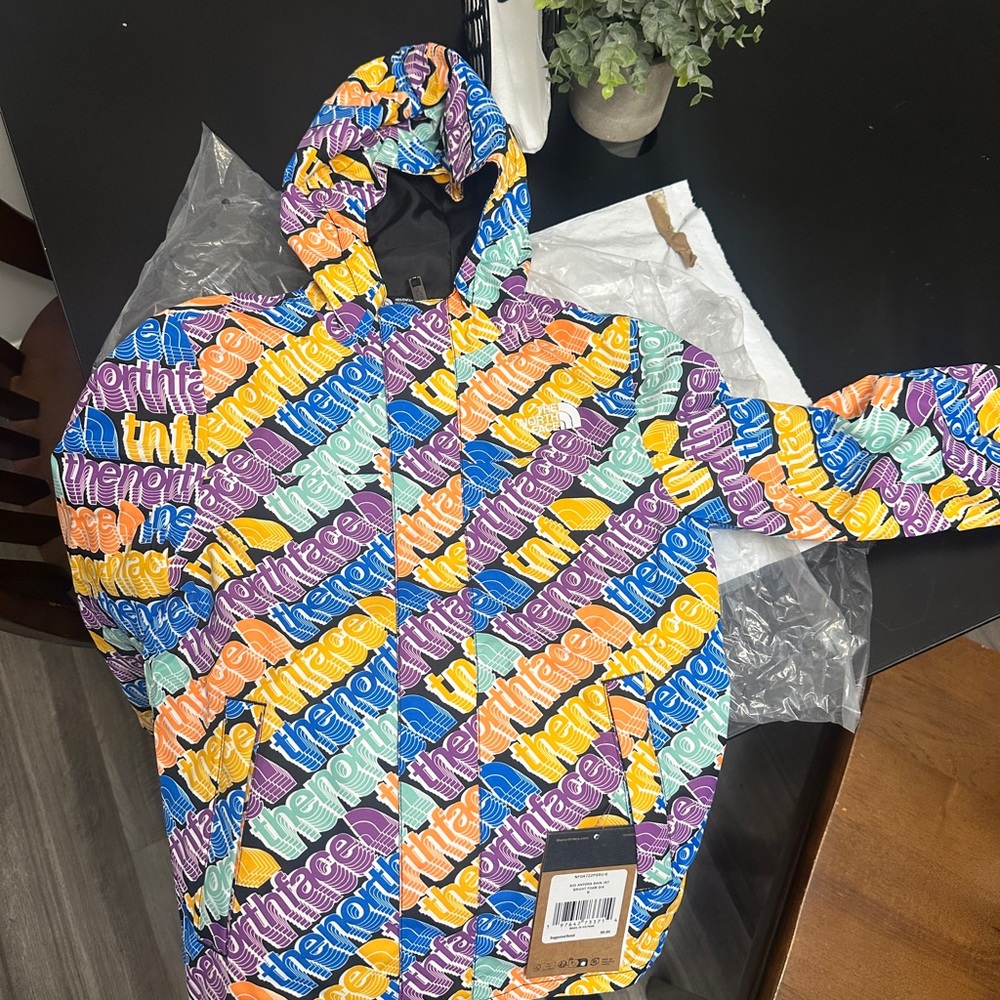 New and Unworn 
Toddler size 6 North Face rain/windbreaker 
Multi-Colored